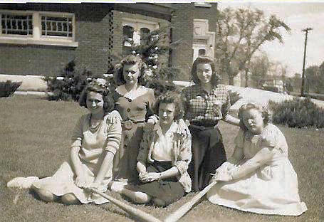 Young women in front of Red Brick School